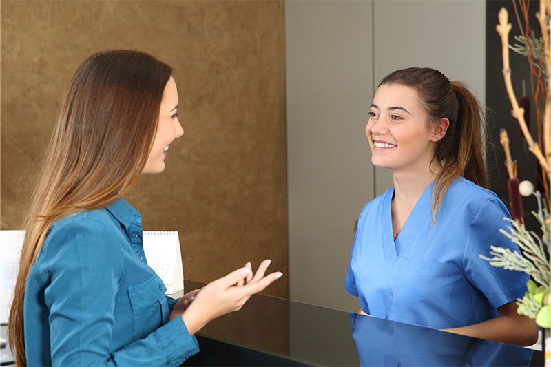 Patient checking in for a dental exam in Indianapolis